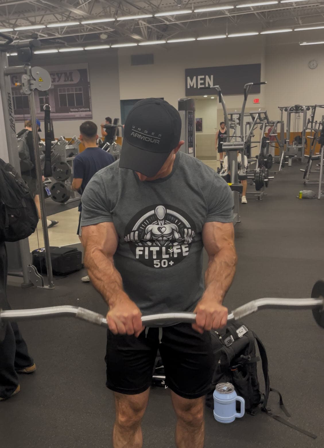 Steve performing reverse-grip curls